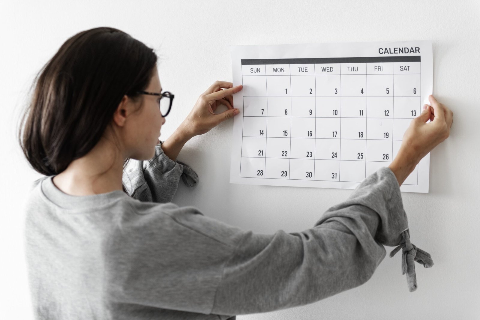 woman checking the calendar min scaled